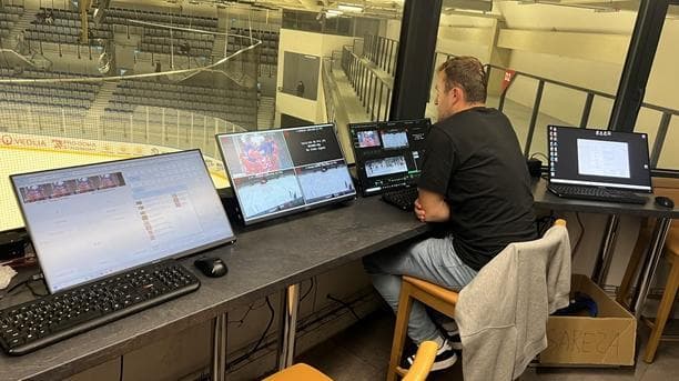 Three-monitor live broadcast station at an ice hockey stadium